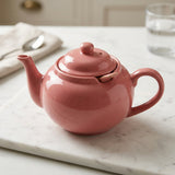 Théière en porcelaine rose avec infuseur